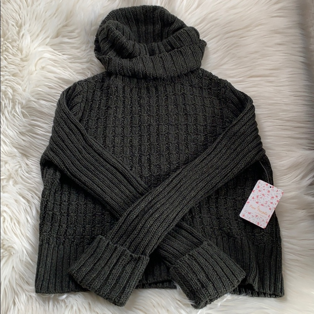 Free People “Twisted Cable” crop sweater.